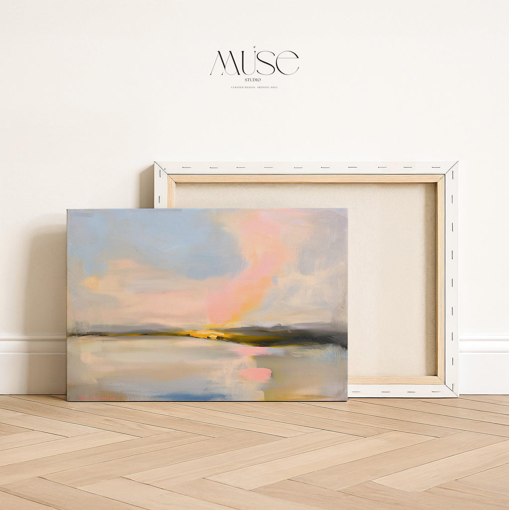 Muse Studio pastel coastal canvas wall art featuring a soft pink and blue abstract landscape with cream, gray, blush, and golden neutral tones. Large square canvas artwork with painterly horizon movement, museum-grade giclée inks, and premium gallery-wrapped cotton canvas, styled above a console for living room, bedroom, office, dining room, or modern coastal interiors.