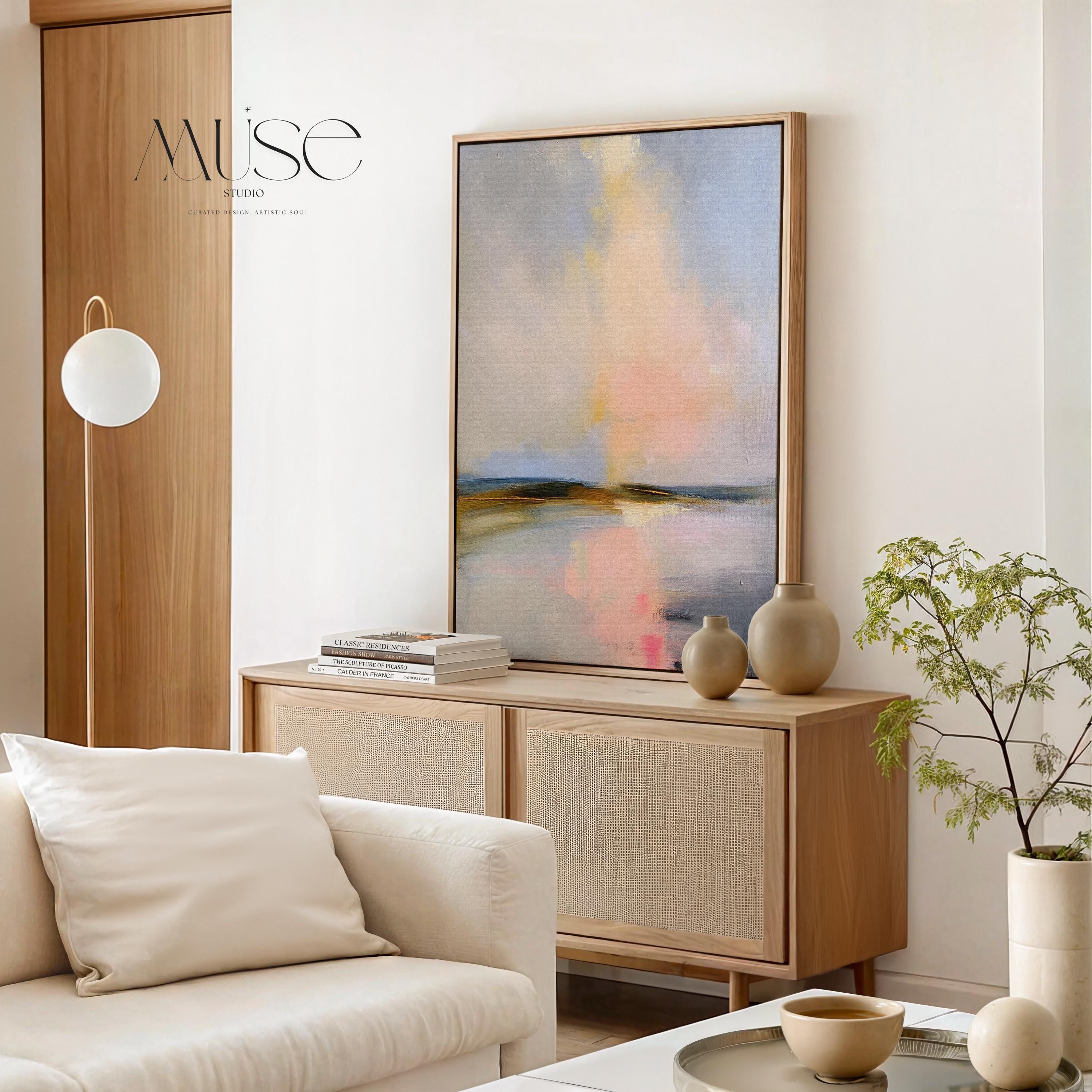 Muse Studio framed coastal wall art featuring a pastel abstract landscape in soft blue, blush pink, cream, gray, and golden neutral tones. Vertical framed canvas artwork with serene horizon movement, museum-grade giclée inks, premium cotton canvas, and custom wood float frame options, styled for living room, bedroom, office, dining room, or modern coastal interiors.