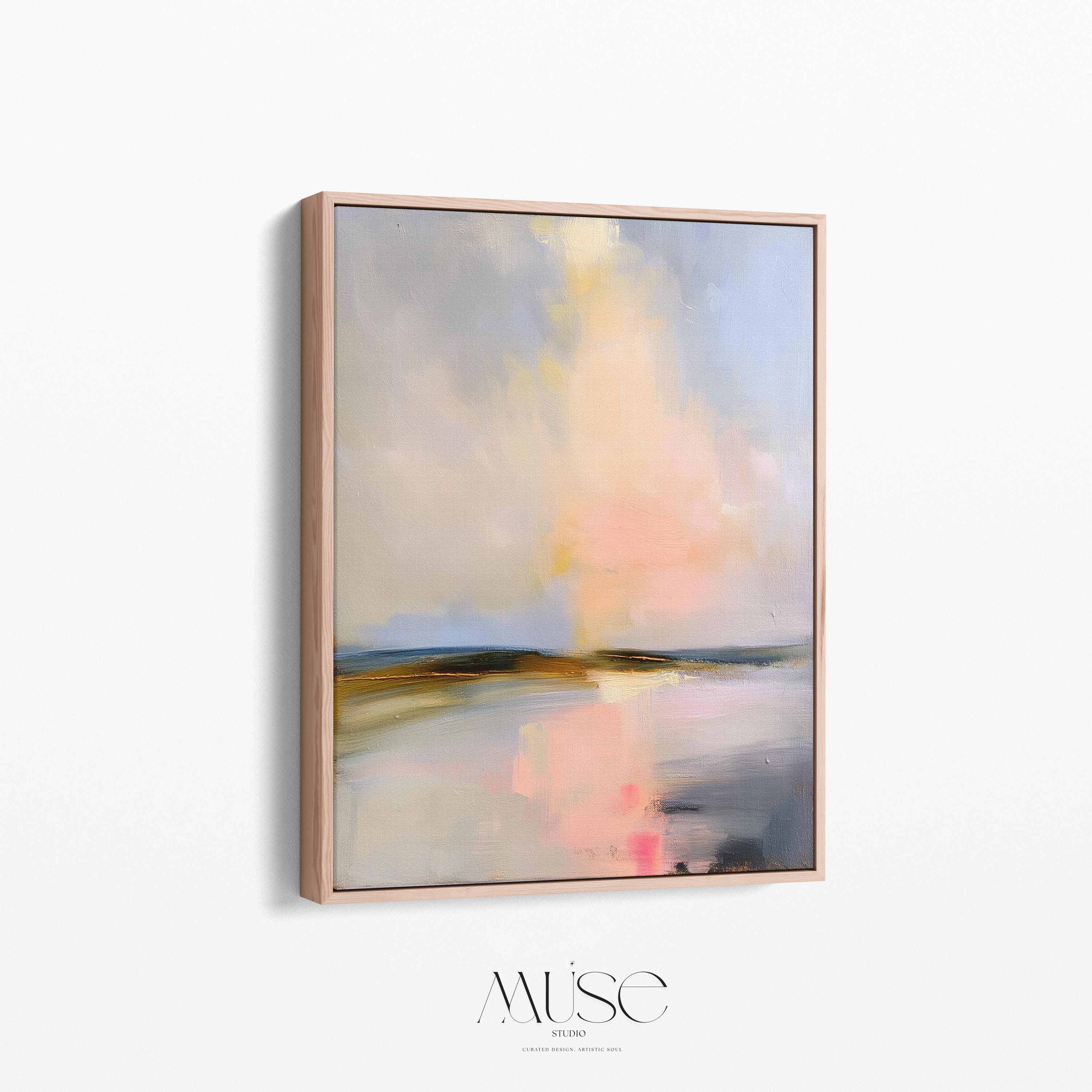 Muse Studio framed coastal wall art featuring a pastel abstract landscape in soft blue, blush pink, cream, gray, and golden neutral tones. Vertical framed canvas artwork with serene horizon movement, museum-grade giclée inks, premium cotton canvas, and custom wood float frame options, styled for living room, bedroom, office, dining room, or modern coastal interiors.