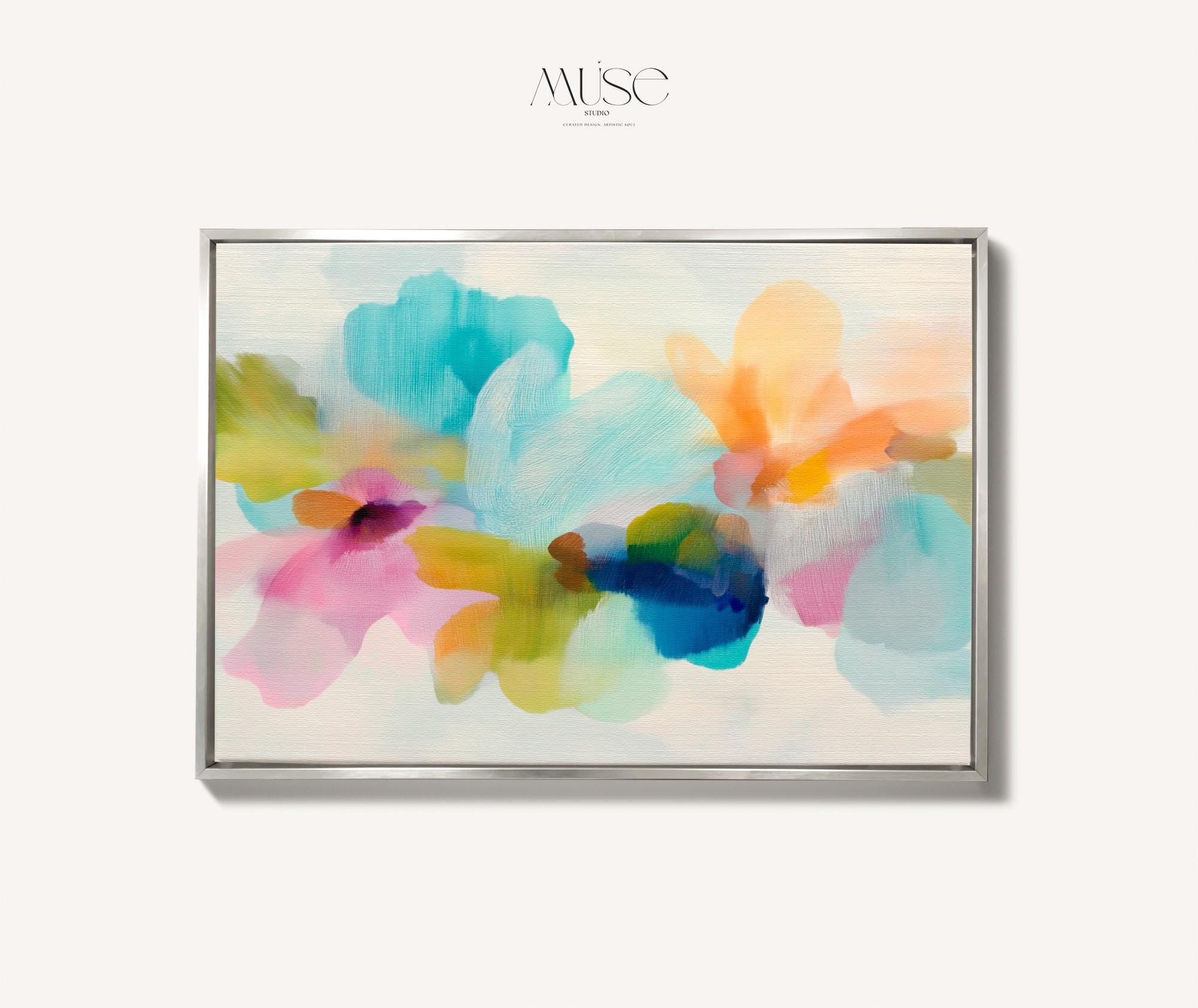 Muse Studio framed canvas wall art in pastel aqua, blush pink, peach, yellow, green, and cobalt blue floral abstract style, printed with museum-grade giclée inks on premium artist-grade canvas, available as a horizontal framed canvas, styled in a serene bedroom, living room, or soft contemporary office.