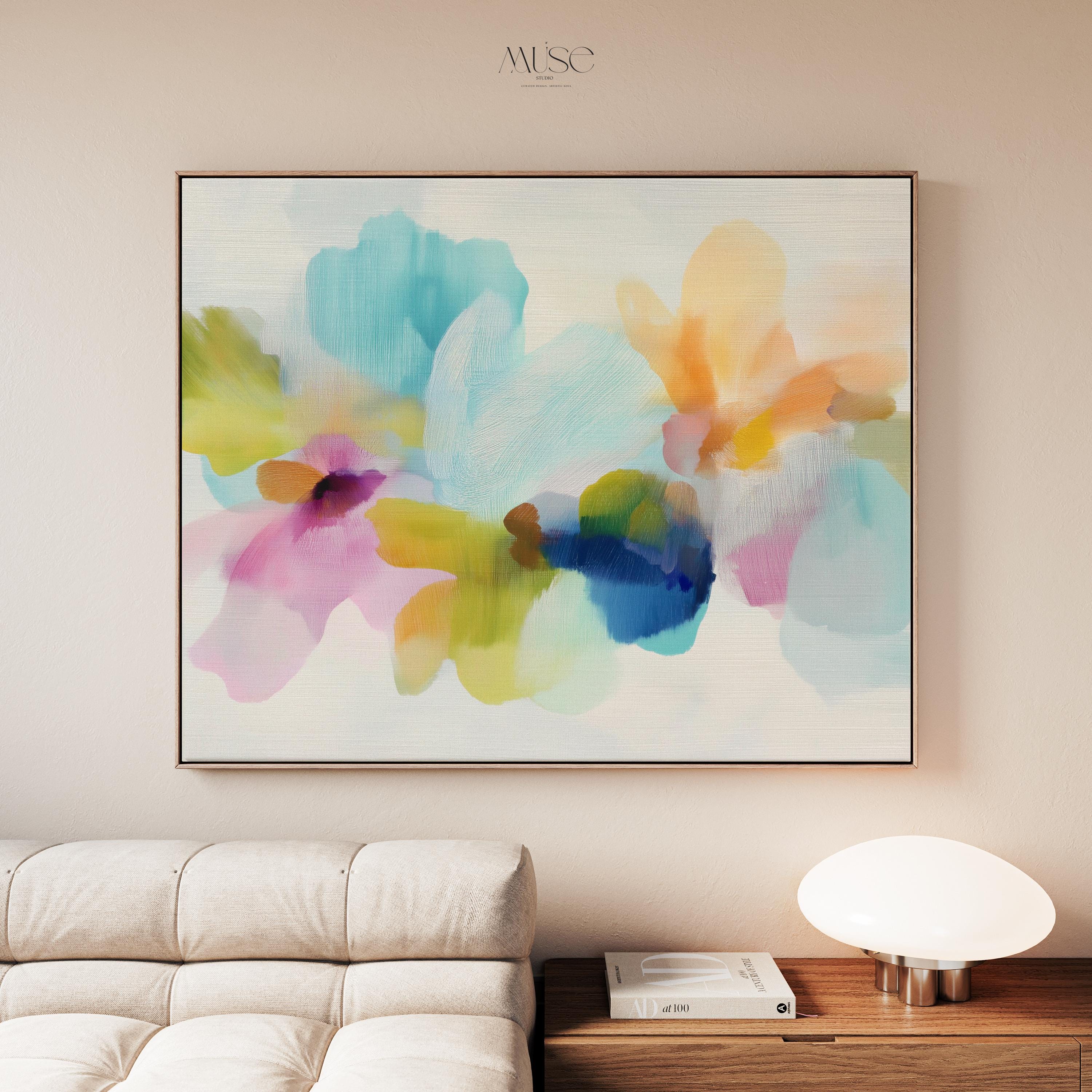 Muse Studio framed canvas wall art in pastel aqua, blush pink, peach, yellow, green, and cobalt blue floral abstract style, printed with museum-grade giclée inks on premium artist-grade canvas, available as a horizontal framed canvas, styled in a serene bedroom, living room, or soft contemporary office.