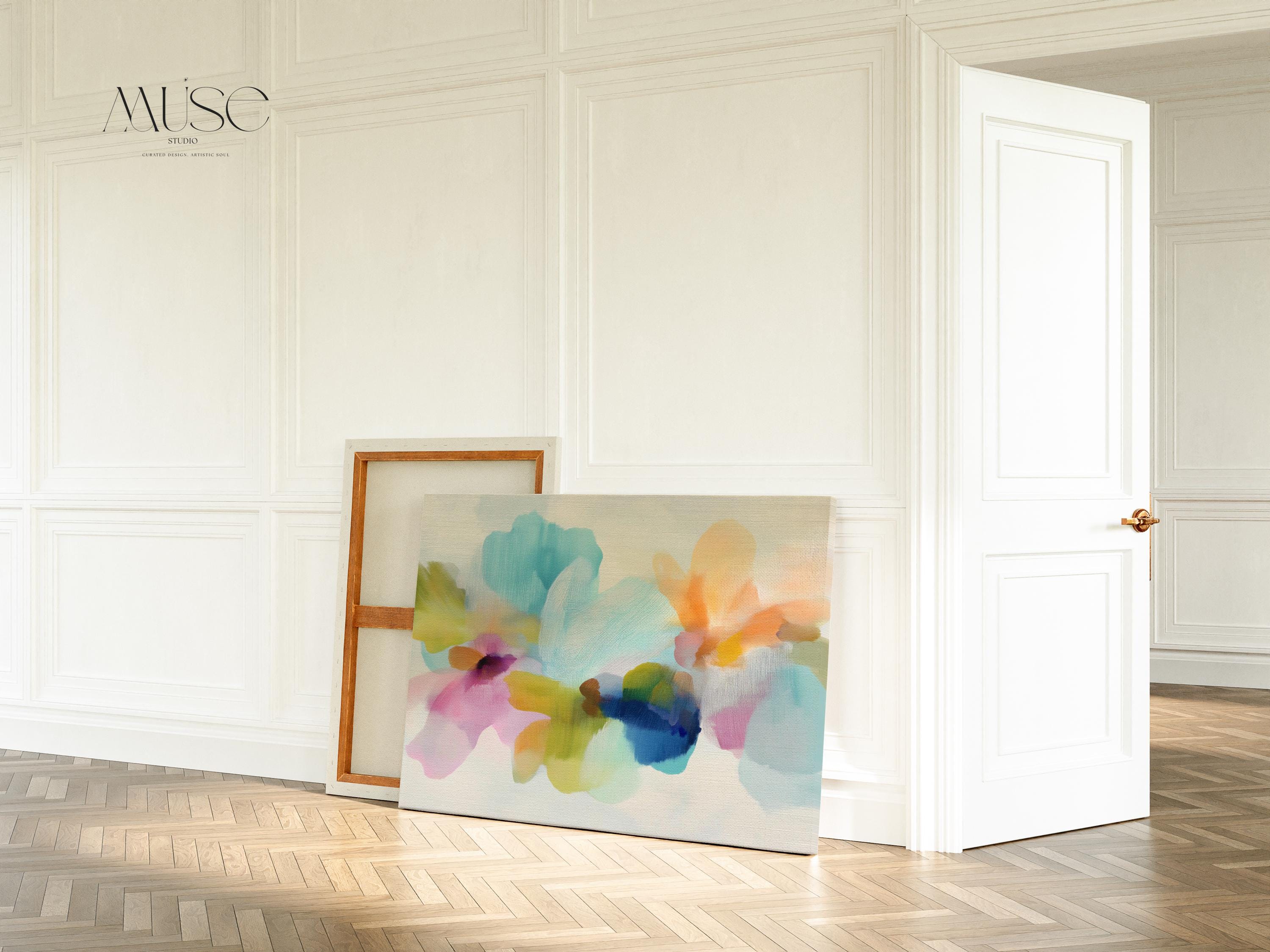 Muse Studio canvas wall art in pastel aqua, blush pink, peach, yellow, green, and cobalt blue floral abstract style, printed with museum-grade giclée inks on premium artist-grade canvas, available as horizontal stretched or rolled canvas, styled in a serene bedroom, living room, or soft contemporary office.