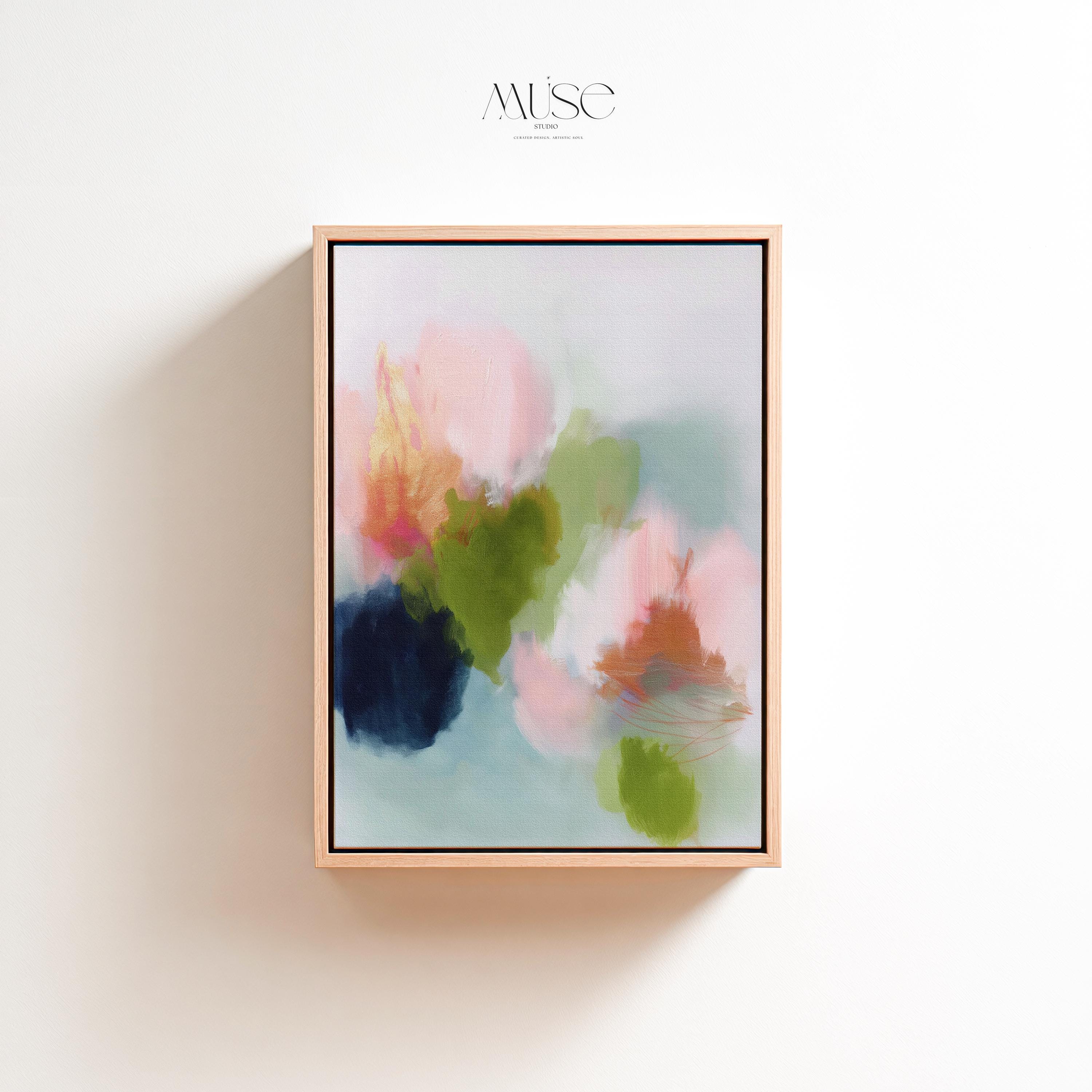 Muse Studio framed wall art in blush pink, olive green, soft aqua, and peach floral abstract tones, printed with museum-grade giclée inks on premium artist canvas and available in custom natural, white, black, antique gold, or antique silver float frames, styled as vertical statement artwork for a bedroom, office, or living room.