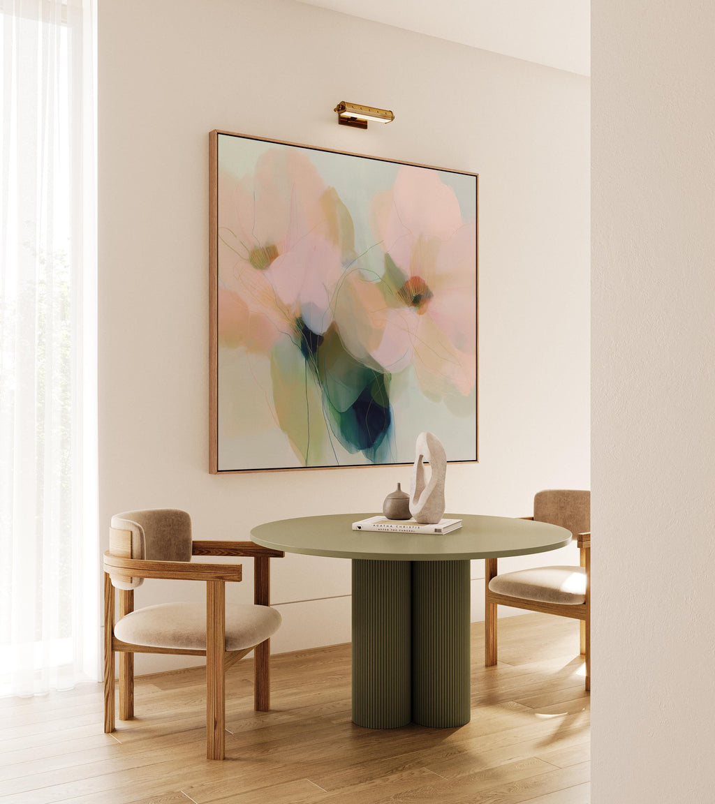 Muse Studio Rosa Vento 1086 neutral botanical wall art shown as a large framed canvas in a soft dining room with cream curtains, warm wood chairs, and vintage rug. This modern floral wall art features blush pink, sage green, aqua, cream, and deep blue-green abstract flowers with delicate linework. Printed with museum-grade giclée inks on premium gallery-wrapped canvas for bedroom, living room, dining room, or office styling.