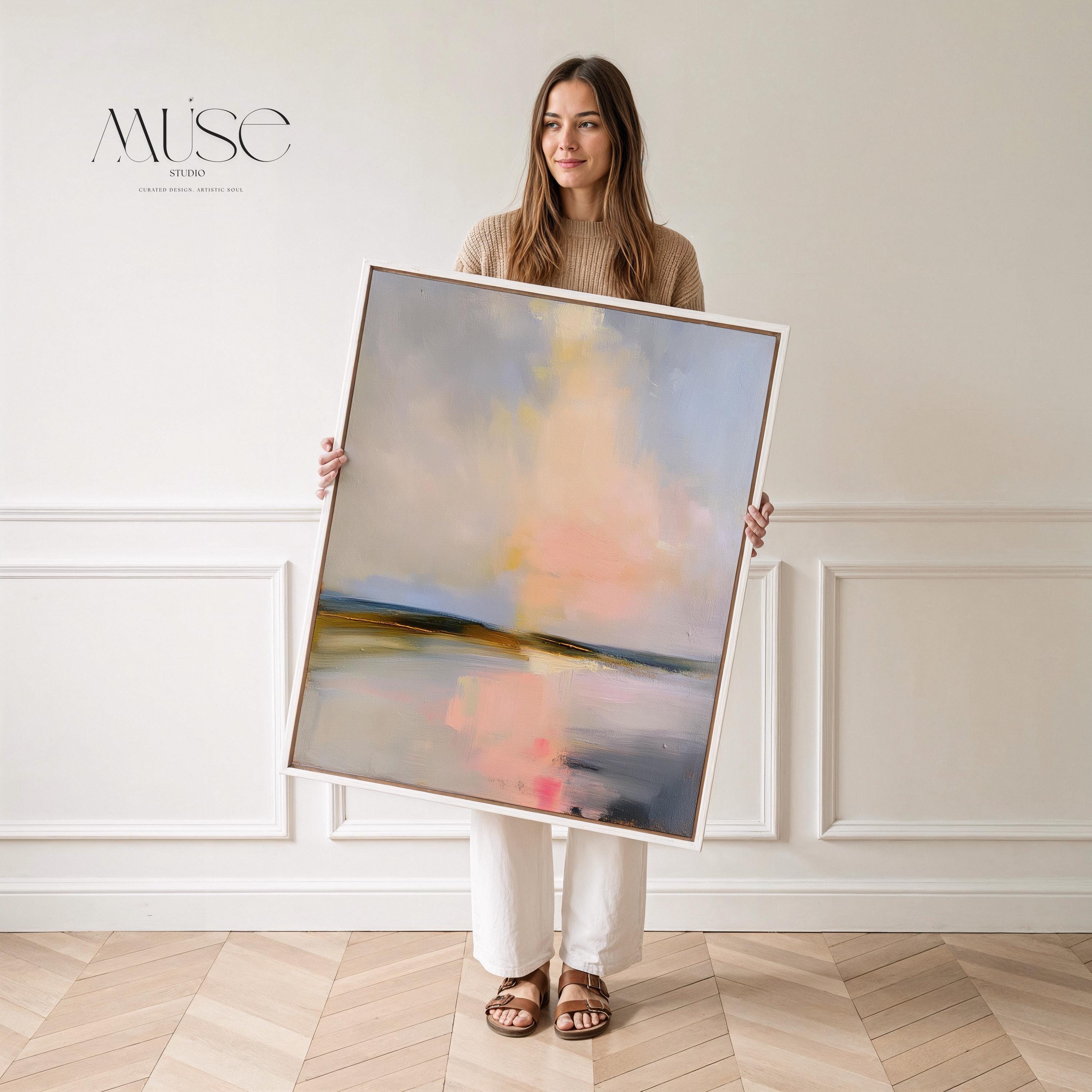 Muse Studio framed coastal wall art featuring a pastel abstract landscape in soft blue, blush pink, cream, gray, and golden neutral tones. Vertical framed canvas artwork with serene horizon movement, museum-grade giclée inks, premium cotton canvas, and custom wood float frame options, styled for living room, bedroom, office, dining room, or modern coastal interiors.
