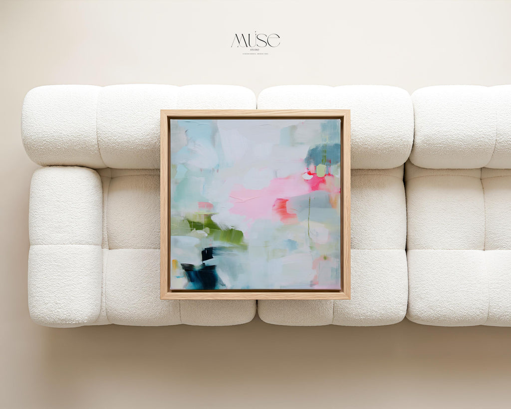 Muse Studio colorful abstract framed canvas wall art featuring soft blue, blush pink, green, coral, white, and navy painterly layers. Museum-grade giclée print on premium gallery-wrapped canvas with custom wood float frame options in natural, white, black, antique gold, and antique silver for modern coastal living room decor.
