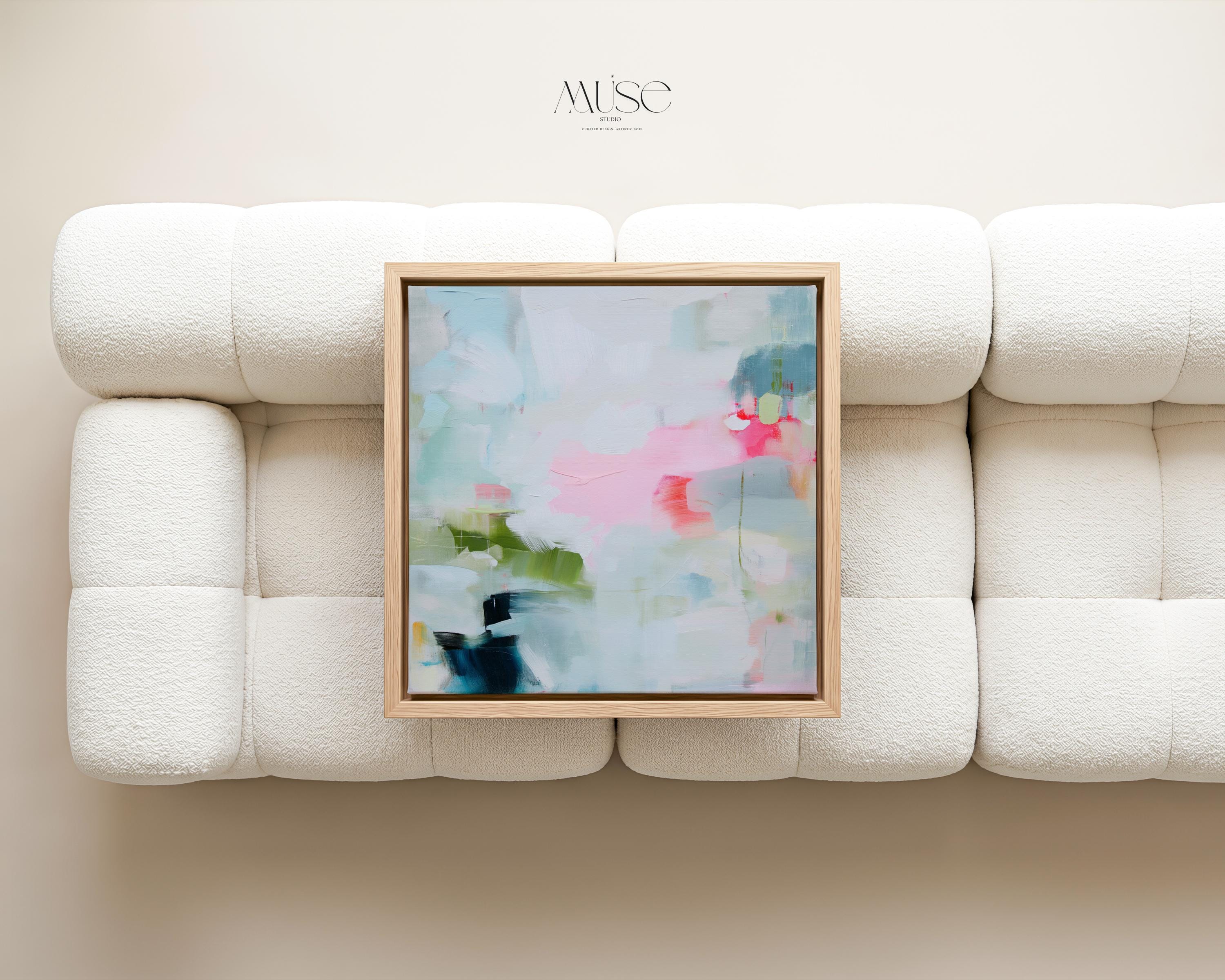 Muse Studio colorful abstract framed canvas wall art featuring soft blue, blush pink, green, coral, white, and navy painterly layers. Museum-grade giclée print on premium gallery-wrapped canvas with custom wood float frame options in natural, white, black, antique gold, and antique silver for modern coastal living room decor.