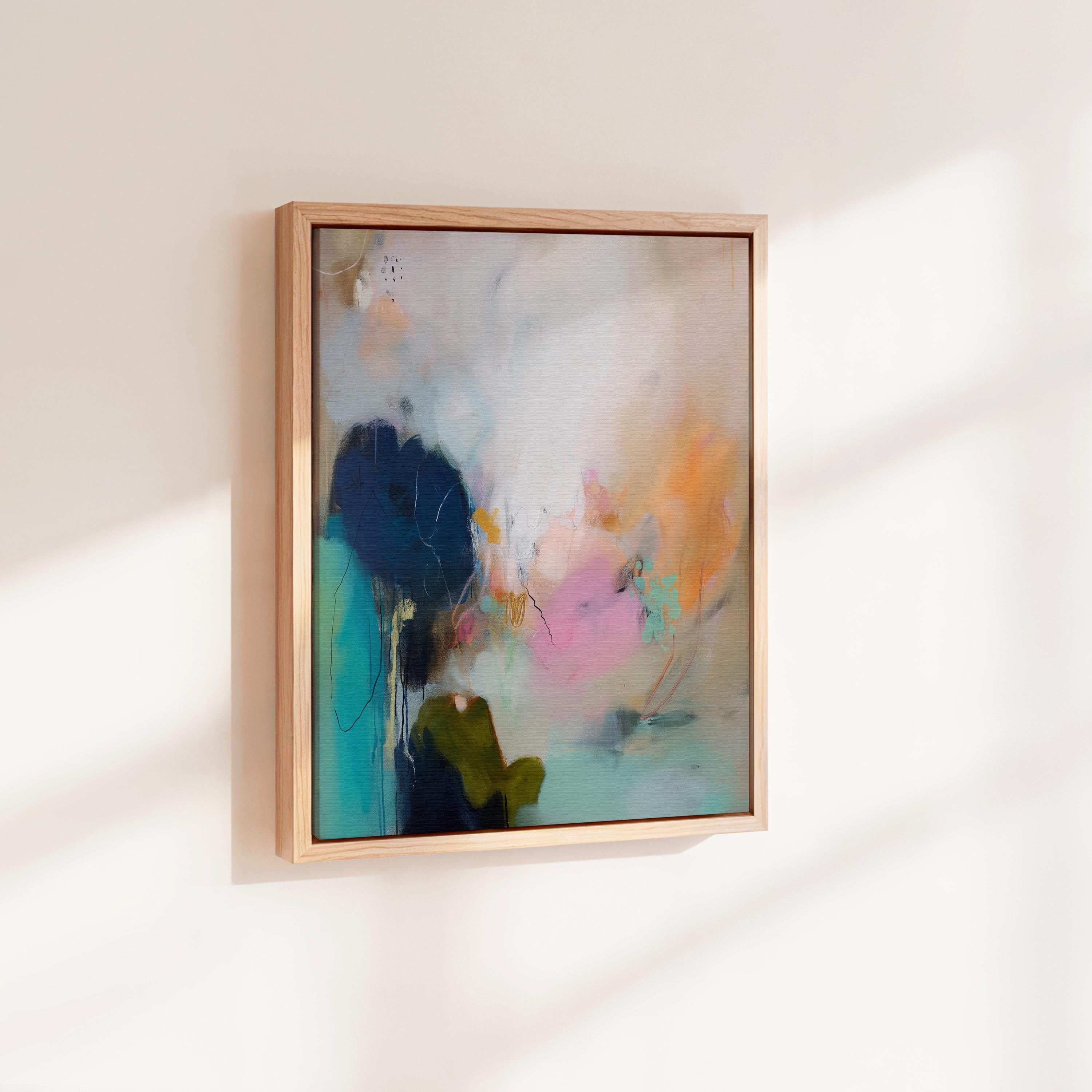 Muse Studio vertical coastal sunset abstract canvas wall art with teal blue ocean-inspired layers, soft pink and peach sunset tones, deep navy contrast, and expressive painterly texture, styled as large modern seashore decor for a living room, office, bedroom, or beach house interior.