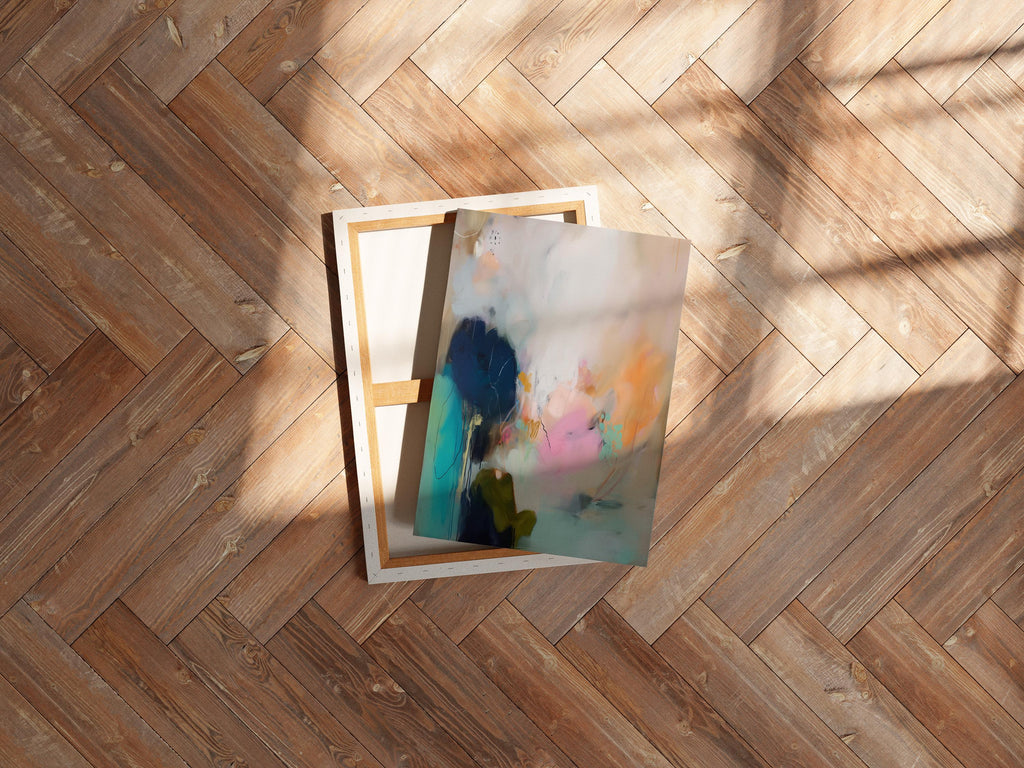 Muse Studio seashore sunset abstract canvas wall art with teal, pink, aqua blue, sea glass green, peach, and navy ocean-inspired layers, styled as coastal wall art and serene bedroom decor for a beach house, living room, or soft modern interior.