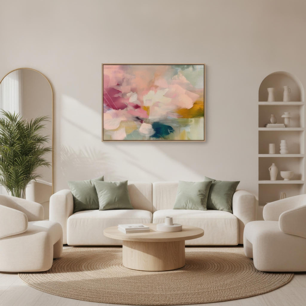 Soft blush, coral, teal and cream floral abstract framed canvas wall art by Muse Studio & Co. in a natural wood floating frame, styled as a calming focal piece in a warm contemporary living space.